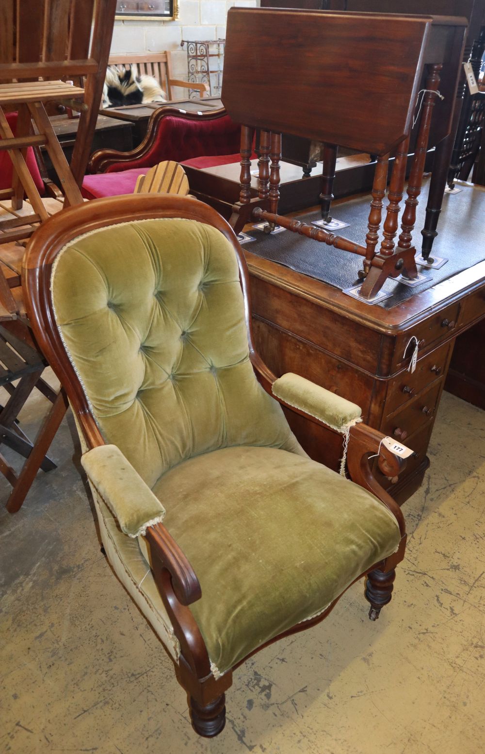 A Victorian spoonback open armchair and an Edwardian mahogany Sutherland table